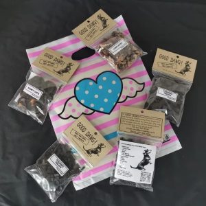 Variety of GoodDawg treats including Ostrich Liver training treats, Lamb Kidney chips, and Sheep Lung bites.