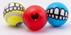 Rogz Grinz Variety Pack for dogs containing a treat ball, a tennis ball, and a squeaky ball